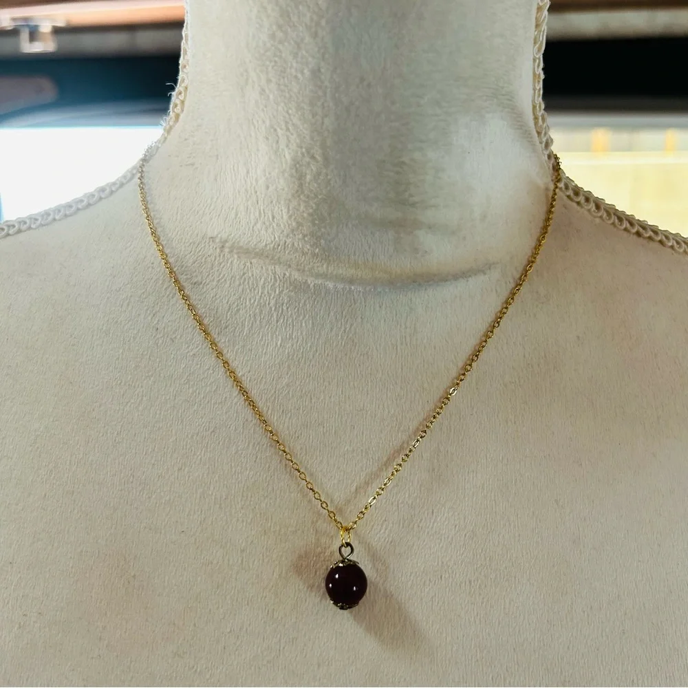 Handcrafted vintage bead capped burgundy glass pendant on chain necklace